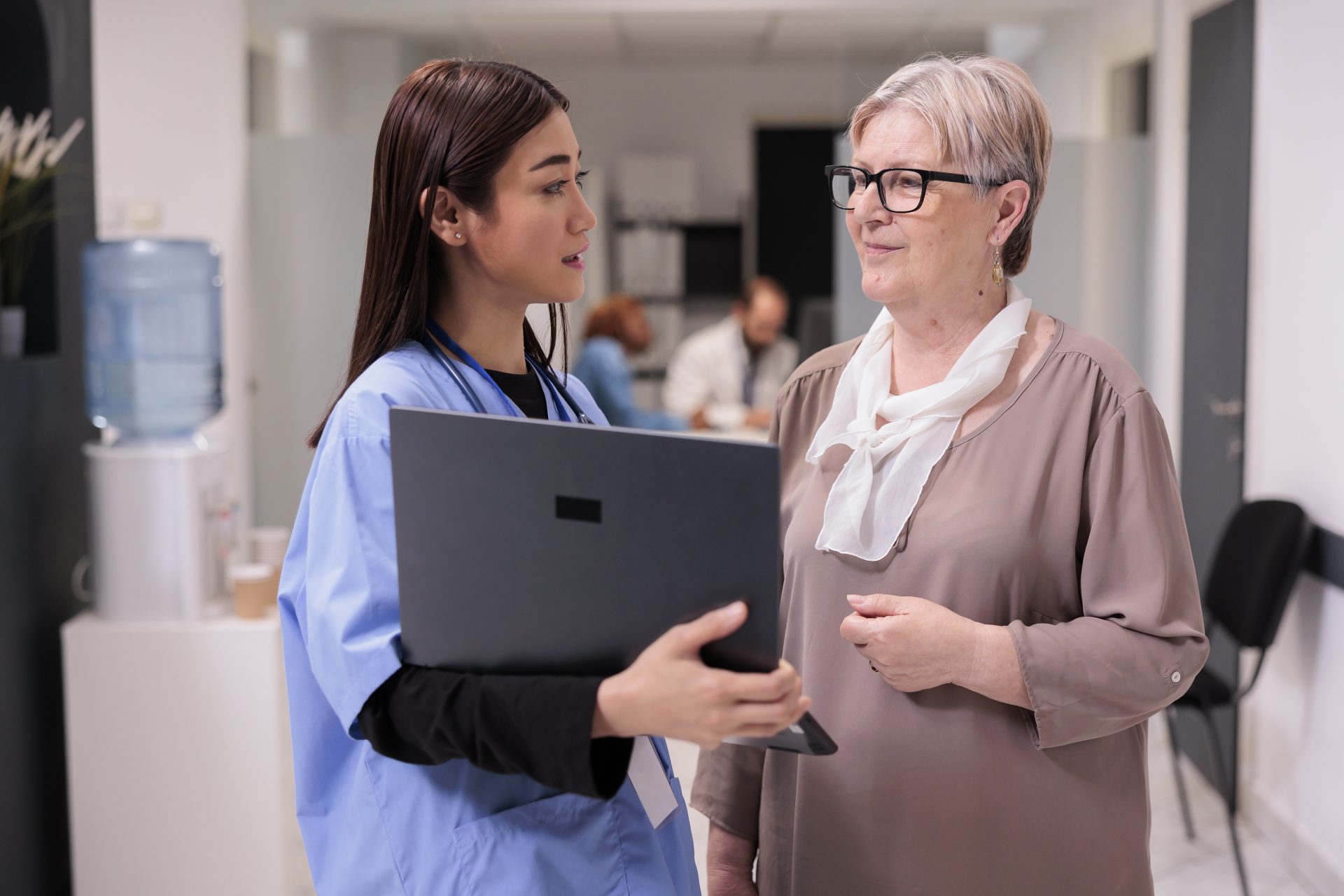 Pharmacist guiding woman at RPM